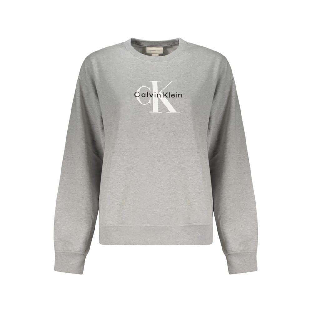 Gray Cotton Women SweaterUnleash the essence of effortless chic with this Calvin Klein masterpiece, a long-sleeved sweatshirt that exudes casual sophistication. The luxurious brushed texture, adorned with intricate embroidery and the iconic Calvin Klein l
