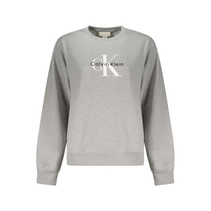 Gray Cotton Women SweaterUnleash the essence of effortless chic with this Calvin Klein masterpiece, a long-sleeved sweatshirt that exudes casual sophistication. The luxurious brushed texture, adorned with intricate embroidery and the iconic Calvin Klein l