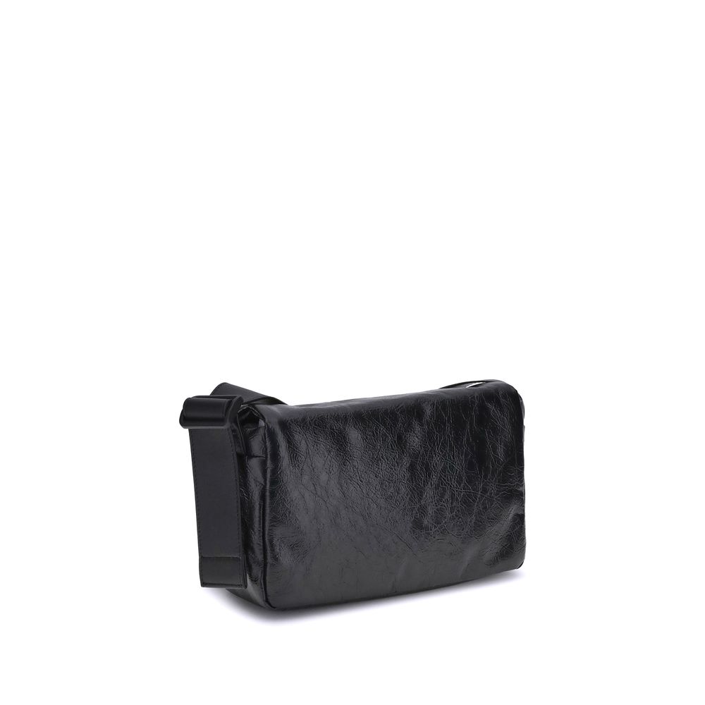 Black Calf Leather Bos Taurus Shoulder BagBalenciaga’s Monaco Shoulder Bag combines clean lines and refined details in an essential and sophisticated design. Crafted in grained-textured leather, it features a top flap with magnetic closure for practicalit