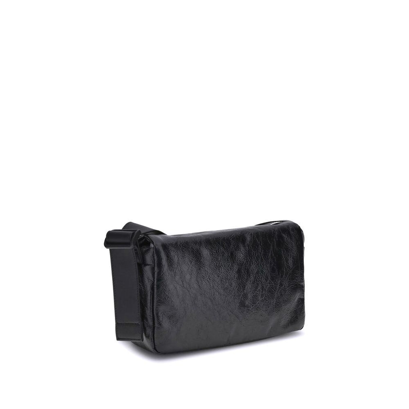Black Calf Leather Bos Taurus Shoulder BagBalenciaga’s Monaco Shoulder Bag combines clean lines and refined details in an essential and sophisticated design. Crafted in grained-textured leather, it features a top flap with magnetic closure for practicalit