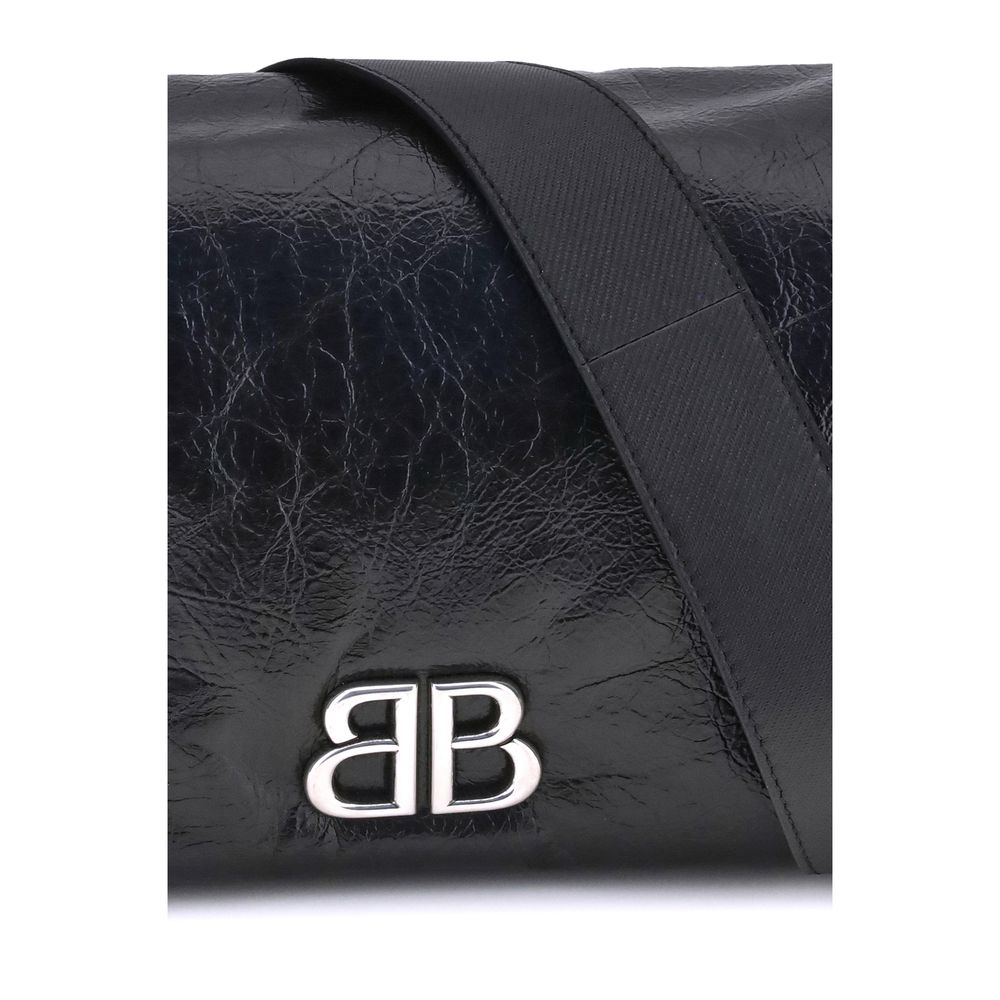 Black Calf Leather Bos Taurus Shoulder BagBalenciaga’s Monaco Shoulder Bag combines clean lines and refined details in an essential and sophisticated design. Crafted in grained-textured leather, it features a top flap with magnetic closure for practicalit