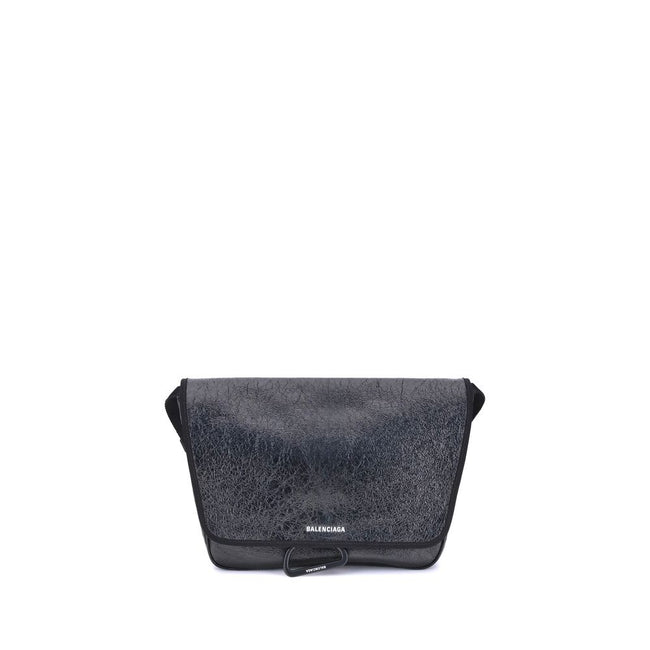 Black Calf Leather Bos Taurus Shoulder BagBalenciaga’s Explorer Shoulder Bag is a practical accessory with an urban style. Crafted from supple Arena lambskin, it features an adjustable shoulder strap and matte black finishes. The embossed and printed Bale