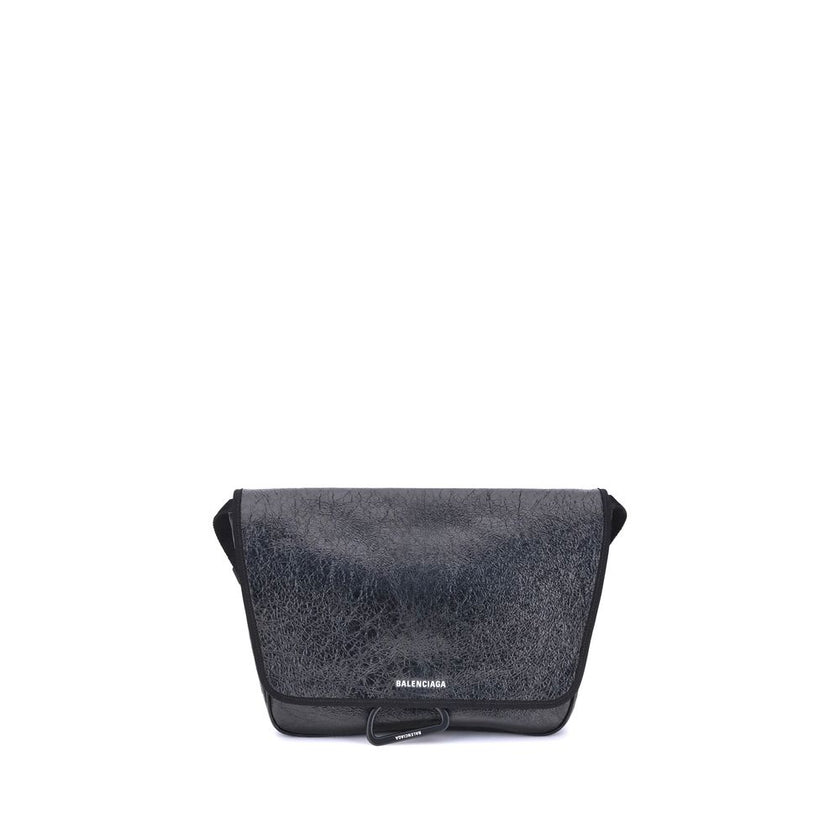 Black Calf Leather Bos Taurus Shoulder BagBalenciaga’s Explorer Shoulder Bag is a practical accessory with an urban style. Crafted from supple Arena lambskin, it features an adjustable shoulder strap and matte black finishes. The embossed and printed Bale