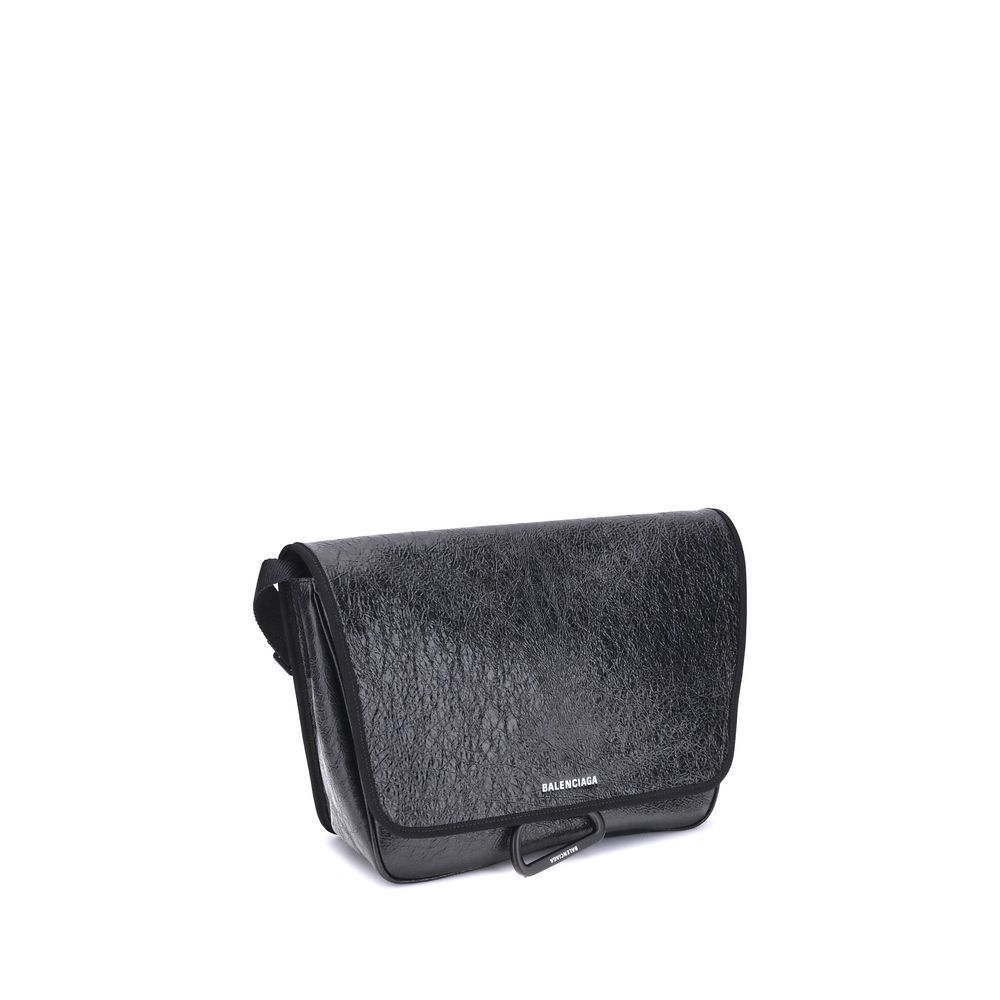 Black Calf Leather Bos Taurus Shoulder BagBalenciaga’s Explorer Shoulder Bag is a practical accessory with an urban style. Crafted from supple Arena lambskin, it features an adjustable shoulder strap and matte black finishes. The embossed and printed Bale