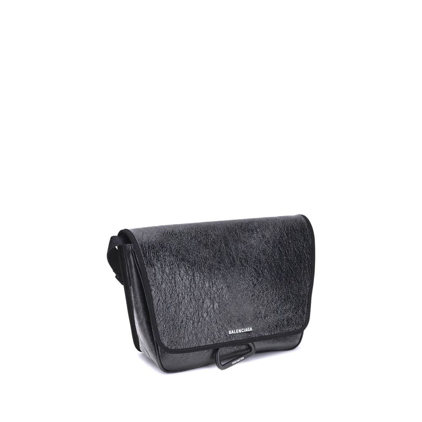 Black Calf Leather Bos Taurus Shoulder BagBalenciaga’s Explorer Shoulder Bag is a practical accessory with an urban style. Crafted from supple Arena lambskin, it features an adjustable shoulder strap and matte black finishes. The embossed and printed Bale