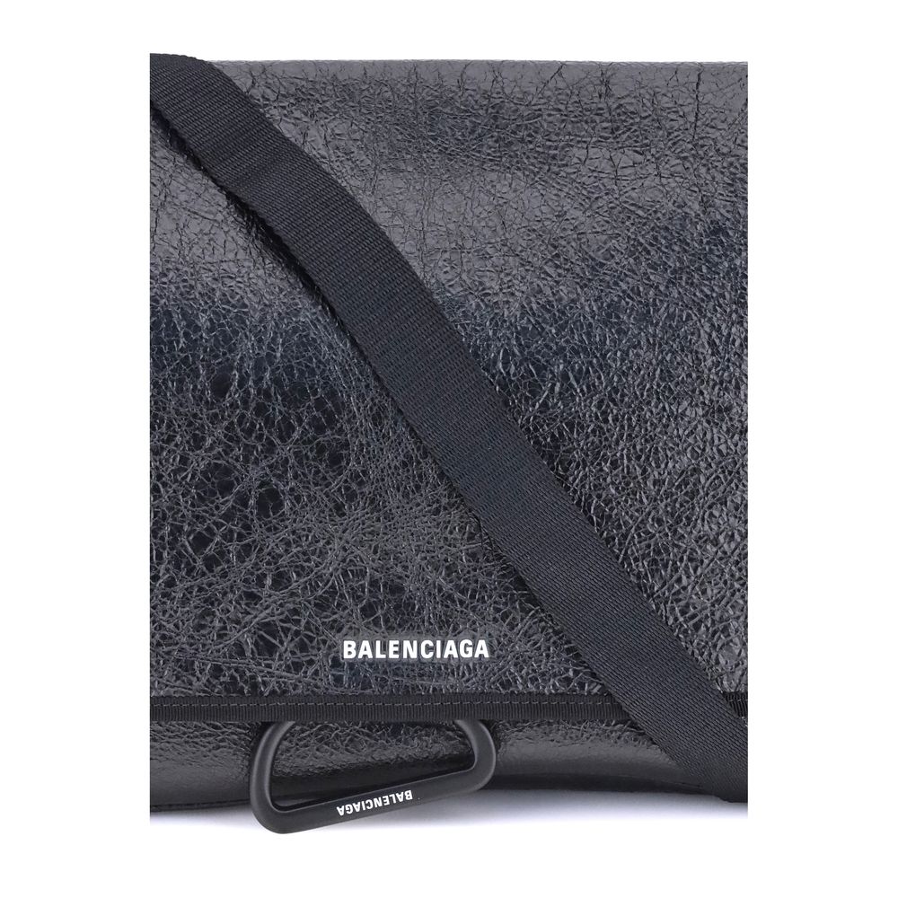 Black Calf Leather Bos Taurus Shoulder BagBalenciaga’s Explorer Shoulder Bag is a practical accessory with an urban style. Crafted from supple Arena lambskin, it features an adjustable shoulder strap and matte black finishes. The embossed and printed Bale