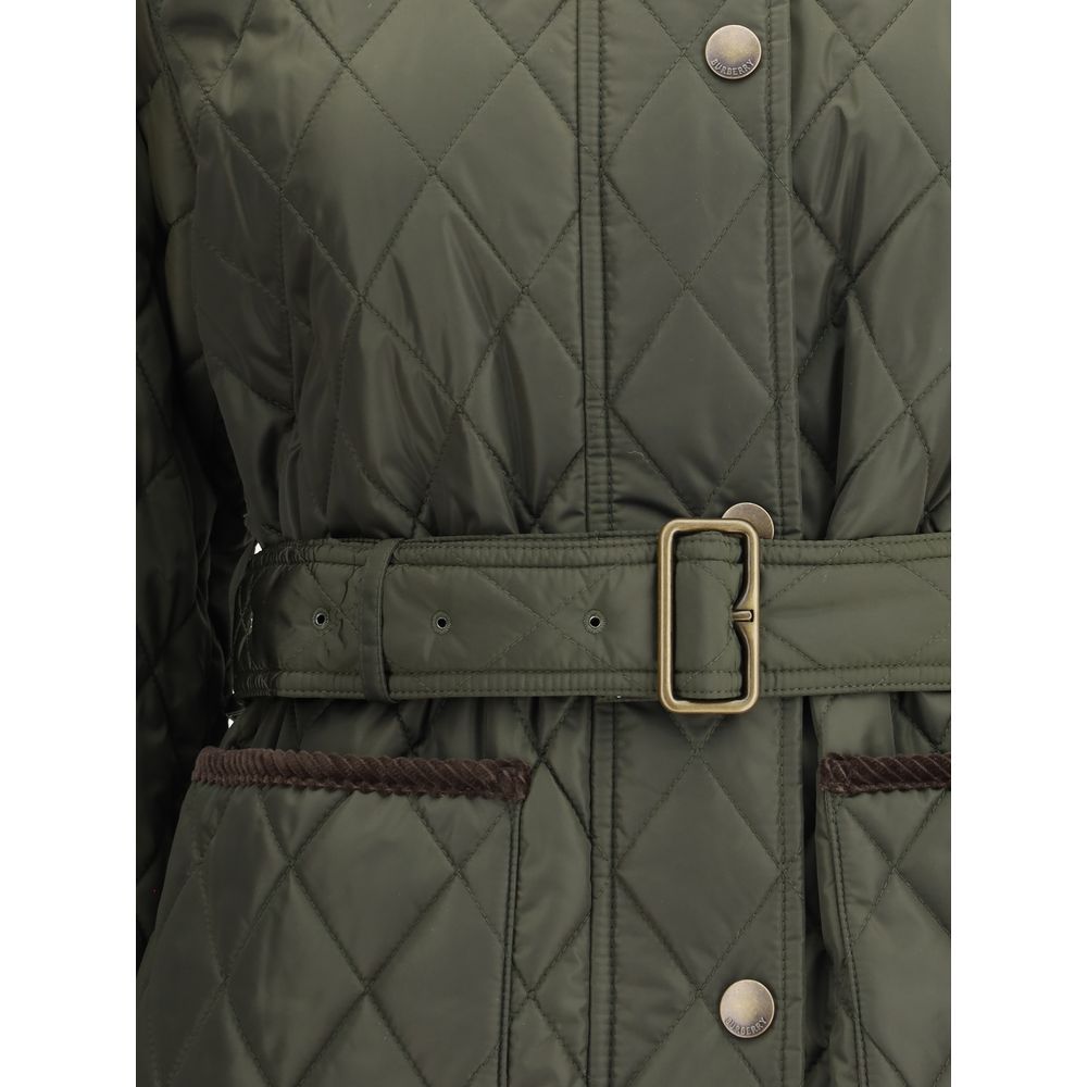 Green Polyamide CoatThe Burberry quilted Jacket is crafted from lightweight Italian-woven nylon, combining functionality with refined style. Featuring a zip and press stud fastening, it is finished with a flattering B-buckle belt. Side patch pockets add p