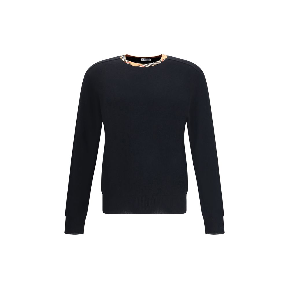 Black Wool SweatshirtThe Burberry Lightweight Wool Sweater is a basic piece with a refined style. The design is enriched by the Burberry Check motif knitted on the collar, in the house’s signature sand tone. The model is completed by the classic ribbed fi