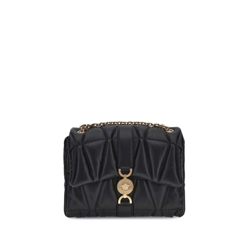 Black Calf Leather Bos Taurus Shoulder BagThe Kleio Shoulder Bag by Versace is crafted from soft quilted lambskin, embellished with the Medusa ’95 metal detail on the front, an iconic symbol of the Maison. The metal chain shoulder strap is versatile and c