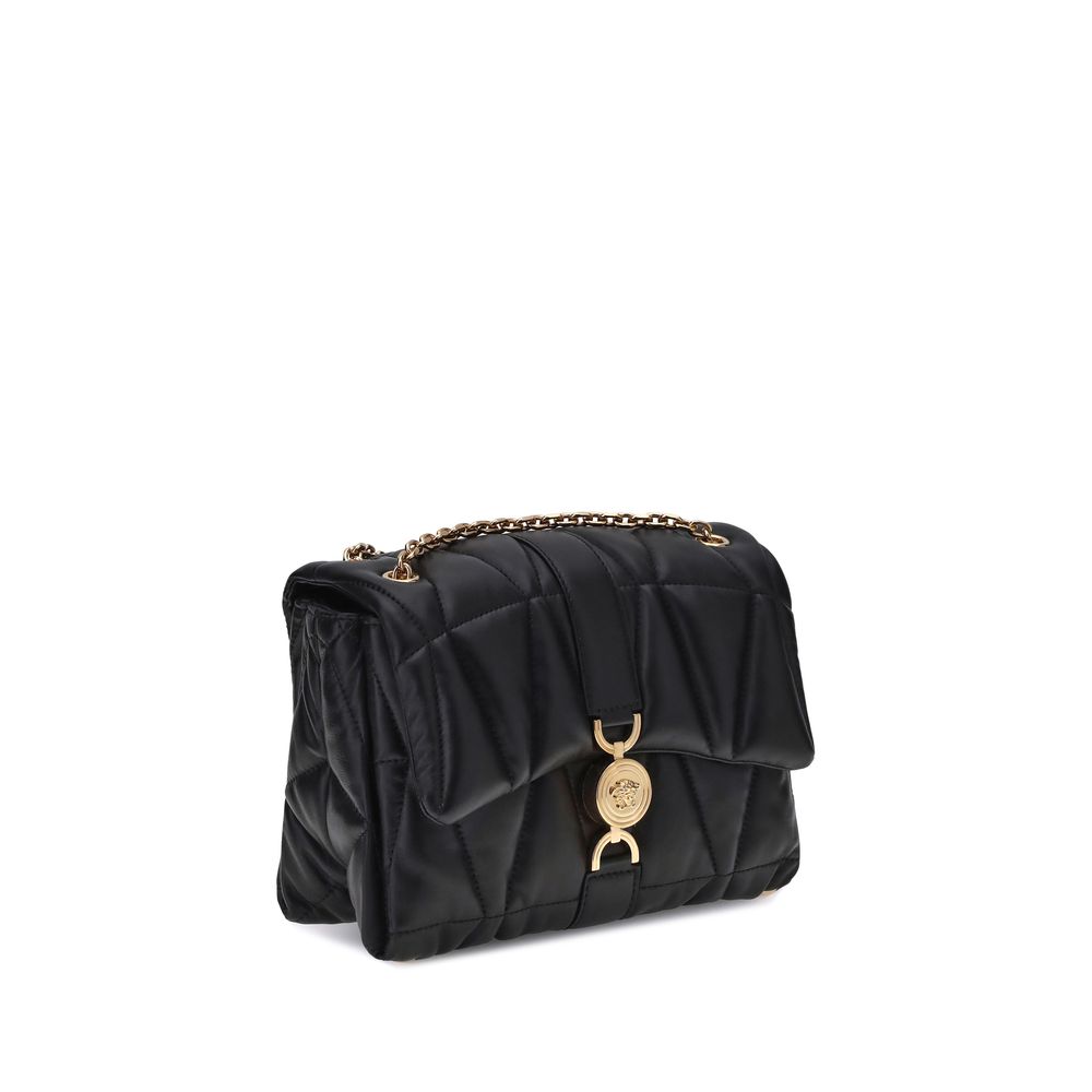 Black Calf Leather Bos Taurus Shoulder BagThe Kleio Shoulder Bag by Versace is crafted from soft quilted lambskin, embellished with the Medusa ’95 metal detail on the front, an iconic symbol of the Maison. The metal chain shoulder strap is versatile and c