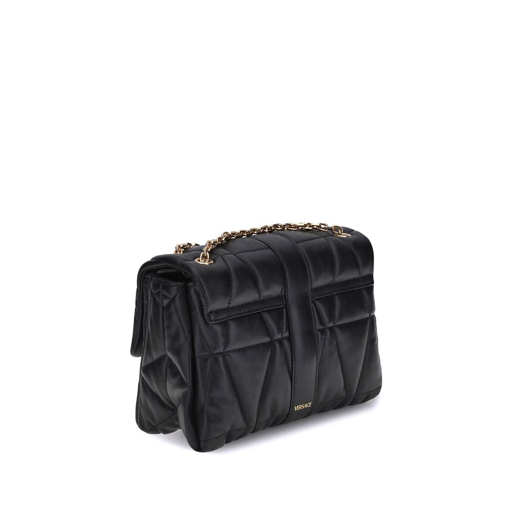 Black Calf Leather Bos Taurus Shoulder BagThe Kleio Shoulder Bag by Versace is crafted from soft quilted lambskin, embellished with the Medusa ’95 metal detail on the front, an iconic symbol of the Maison. The metal chain shoulder strap is versatile and c