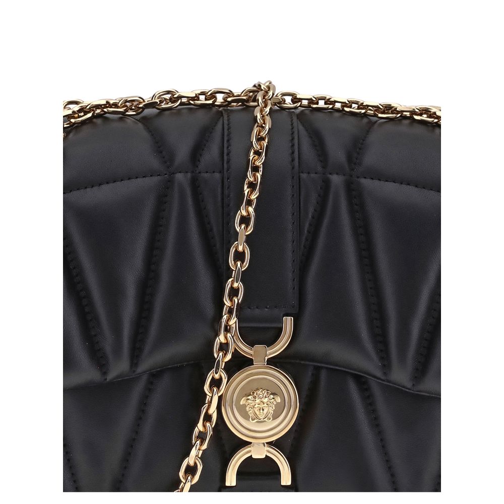 Black Calf Leather Bos Taurus Shoulder BagThe Kleio Shoulder Bag by Versace is crafted from soft quilted lambskin, embellished with the Medusa ’95 metal detail on the front, an iconic symbol of the Maison. The metal chain shoulder strap is versatile and c