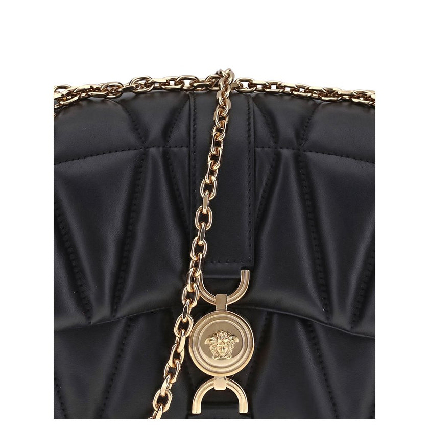 Black Calf Leather Bos Taurus Shoulder BagThe Kleio Shoulder Bag by Versace is crafted from soft quilted lambskin, embellished with the Medusa ’95 metal detail on the front, an iconic symbol of the Maison. The metal chain shoulder strap is versatile and c