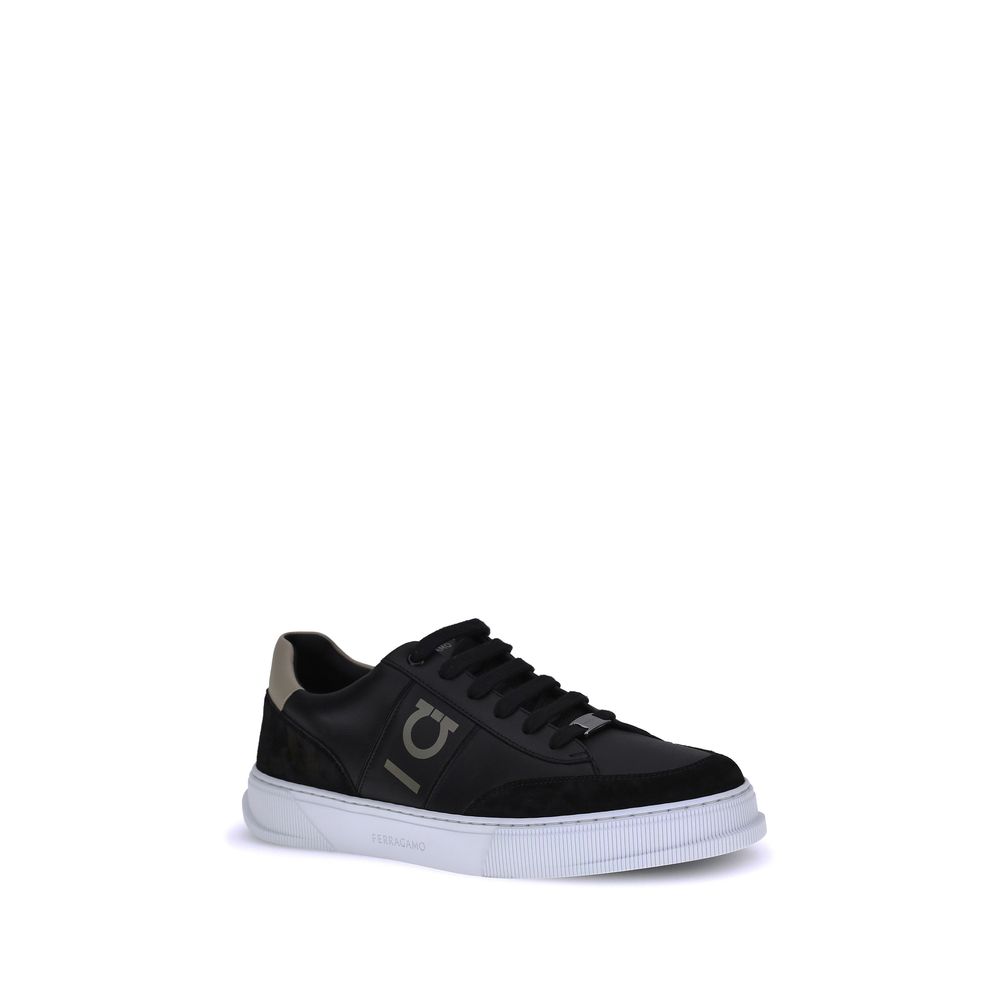 Black Calf Leather Bos Taurus Low Top SneakersFerragamo Sneakers offer a refined reinterpretation of the classic low sneaker. Crafted with a leather upper and tone-on-tone suede profiles, they stand out for the Gancini detail on the side, an iconic symbol