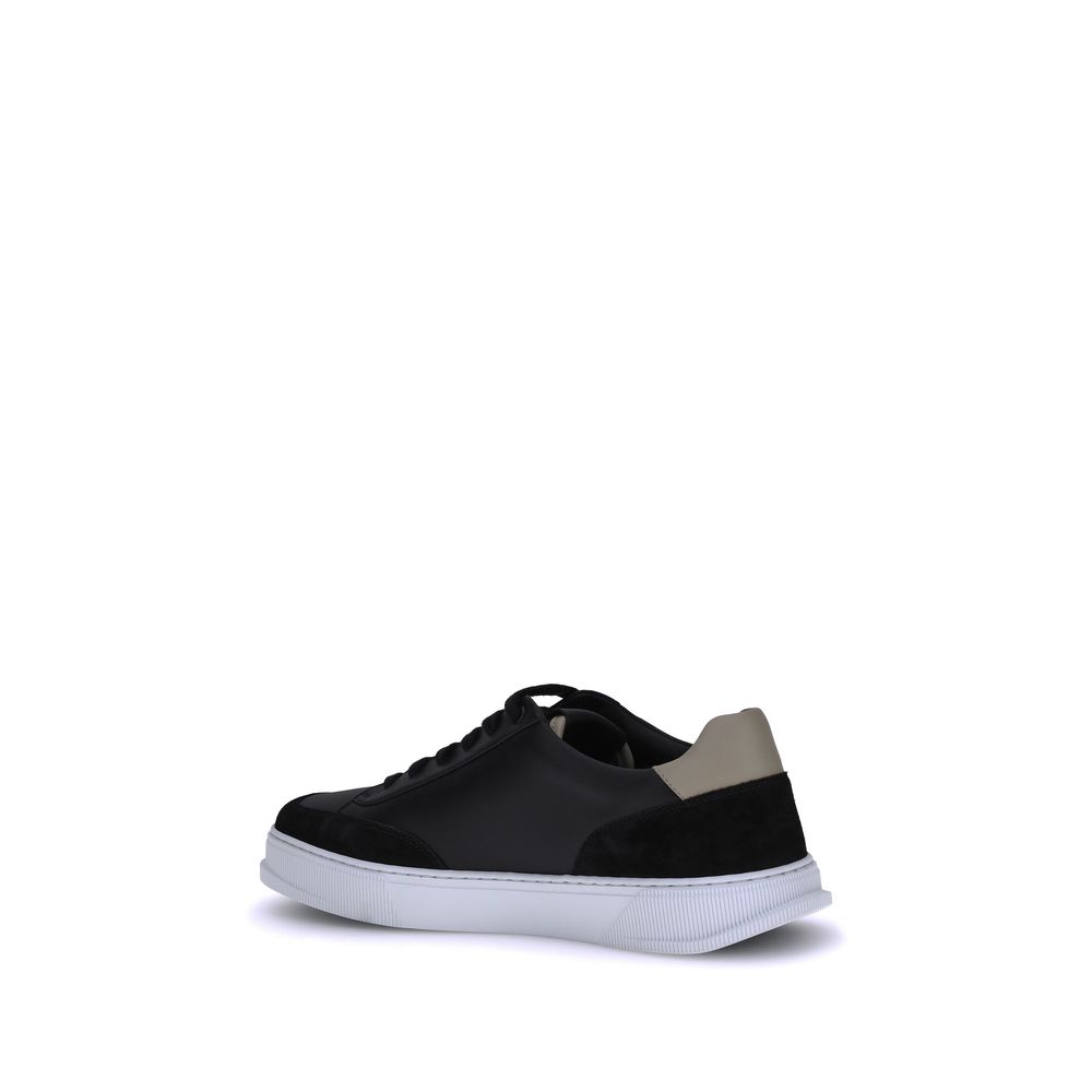 Black Calf Leather Bos Taurus Low Top SneakersFerragamo Sneakers offer a refined reinterpretation of the classic low sneaker. Crafted with a leather upper and tone-on-tone suede profiles, they stand out for the Gancini detail on the side, an iconic symbol