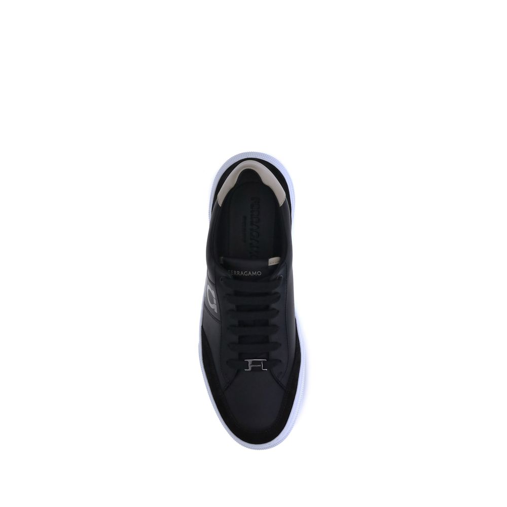 Black Calf Leather Bos Taurus Low Top SneakersFerragamo Sneakers offer a refined reinterpretation of the classic low sneaker. Crafted with a leather upper and tone-on-tone suede profiles, they stand out for the Gancini detail on the side, an iconic symbol