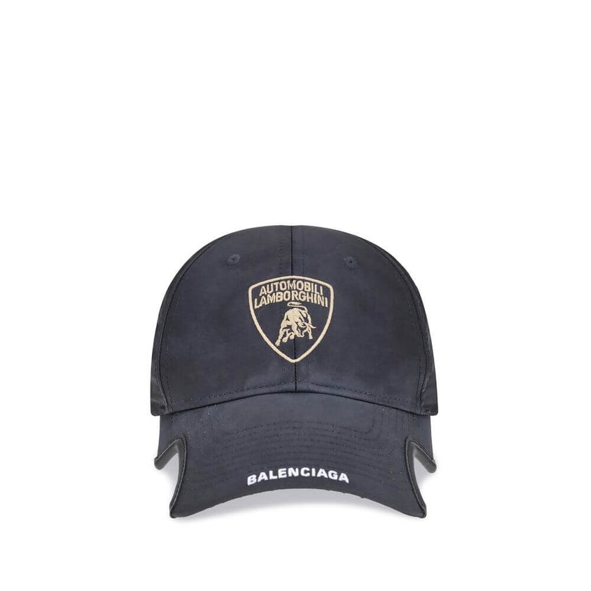 Black Cotton Cap (Baseball Hat)The Lamborghini x Balenciaga Baseball Cap is a bold accessory born from the collaboration between two icons of luxury and design. Featuring embroidered ventilation eyelets on the top, it has a distinctive cut-out visor on bo