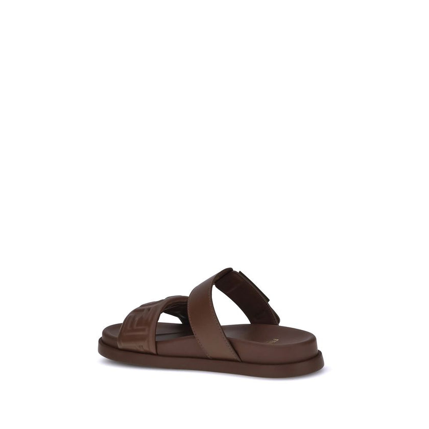Brown Calf Leather Bos Taurus Flat SandalsLeather Sandals with FF detail by Fendi, a perfect combination of iconic style and everyday comfort. The design is defined by a double front band embellished with the embossed FF motif, the unmistakable symbol of