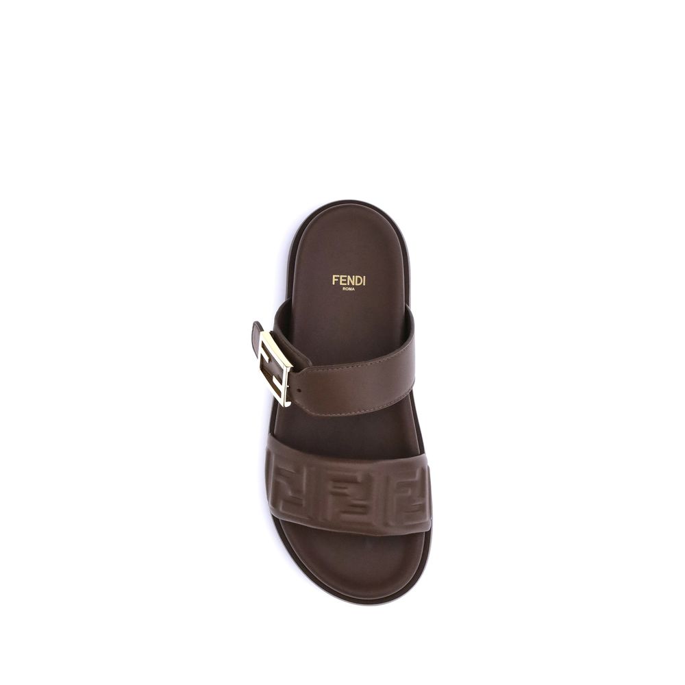 Brown Calf Leather Bos Taurus Flat SandalsLeather Sandals with FF detail by Fendi, a perfect combination of iconic style and everyday comfort. The design is defined by a double front band embellished with the embossed FF motif, the unmistakable symbol of