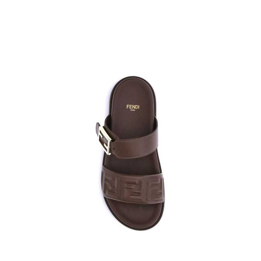 Brown Calf Leather Bos Taurus Flat SandalsLeather Sandals with FF detail by Fendi, a perfect combination of iconic style and everyday comfort. The design is defined by a double front band embellished with the embossed FF motif, the unmistakable symbol of