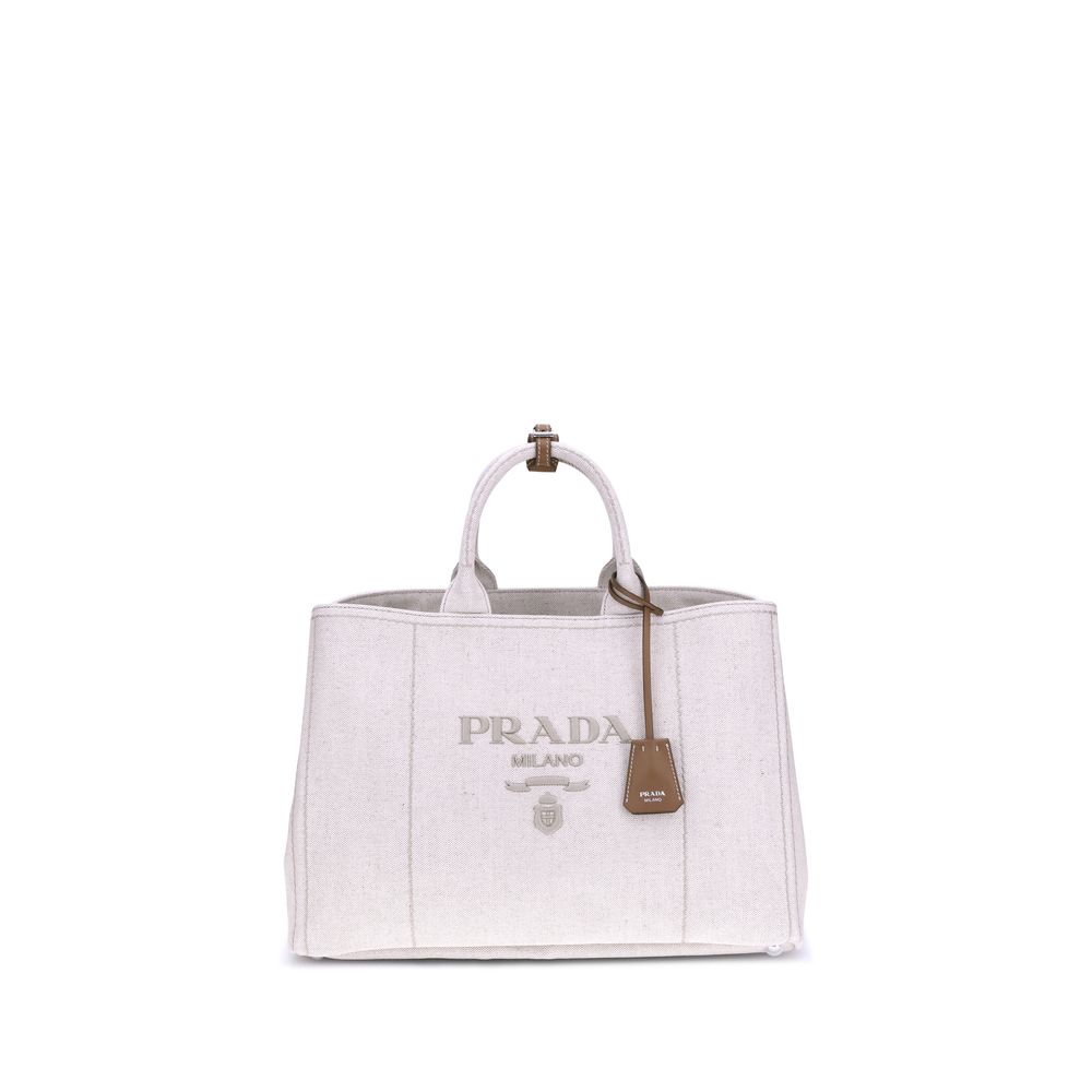 Cream Cotton Shoulder BagPrada’s extra large Jardinière Handbag combines elegance and functionality in a high-quality linen blend. Featuring two tubular handles and exposed topstitching, it has an adjustable and removable ribbon shoulder strap for differe