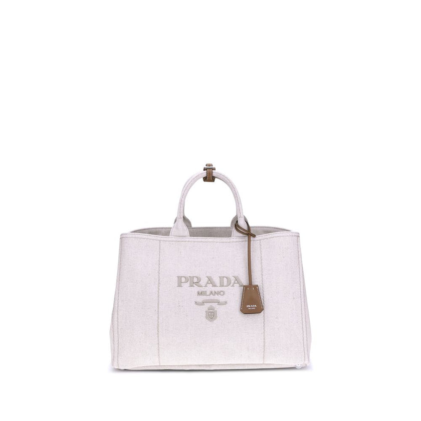 Cream Cotton Shoulder BagPrada’s extra large Jardinière Handbag combines elegance and functionality in a high-quality linen blend. Featuring two tubular handles and exposed topstitching, it has an adjustable and removable ribbon shoulder strap for differe