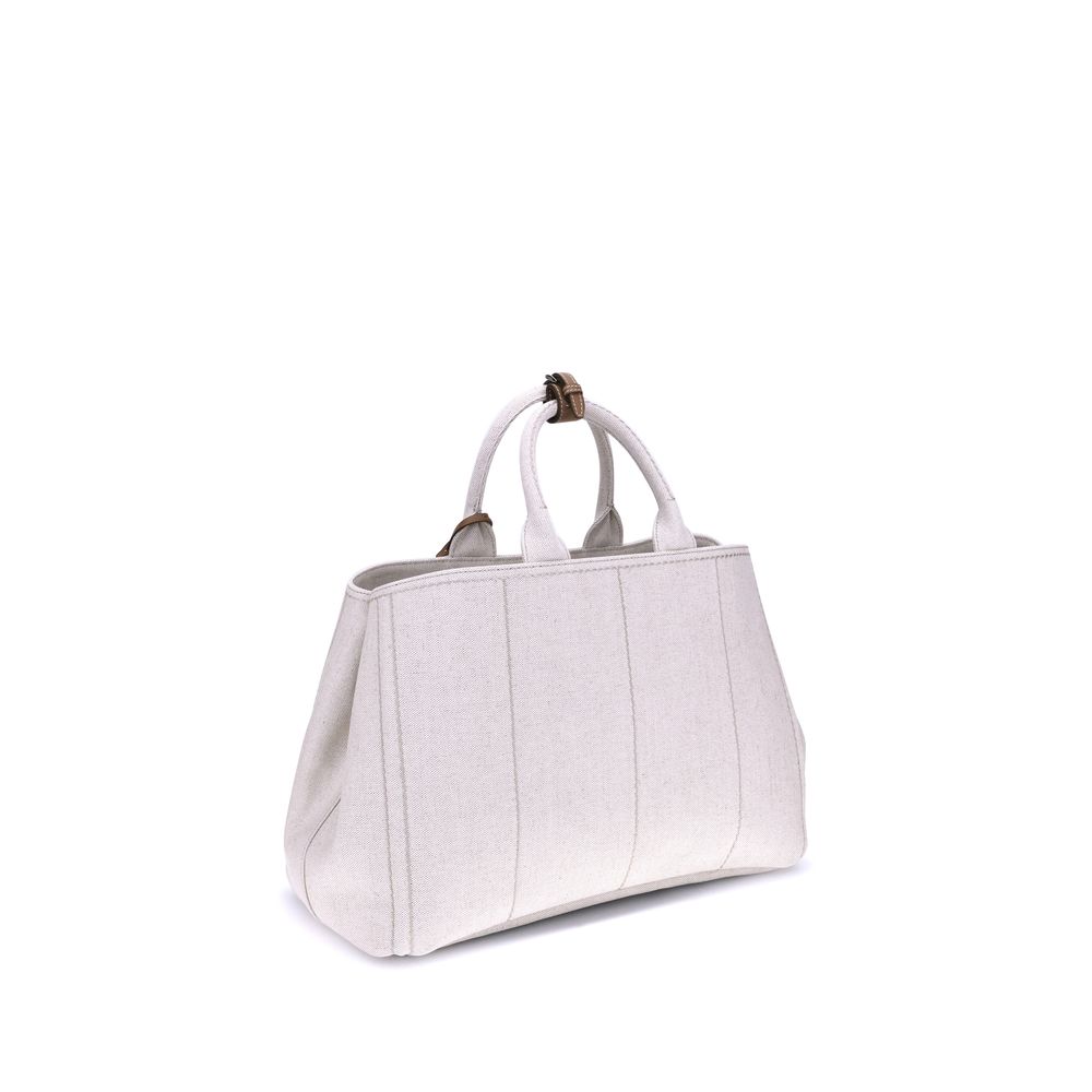 Cream Cotton Shoulder BagPrada’s extra large Jardinière Handbag combines elegance and functionality in a high-quality linen blend. Featuring two tubular handles and exposed topstitching, it has an adjustable and removable ribbon shoulder strap for differe