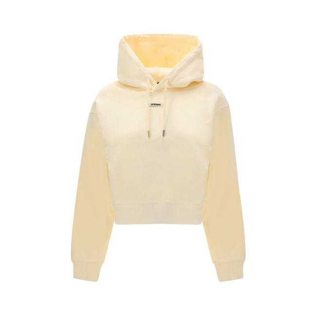 Cream Cotton SweatshirtCotton Hoodie by Jacquemus, featuring an adjustable drawstring hood for a custom fit. Featuring a logo patch on the front, ribbed cuffs and hem for a finishing touch. The slim fit flatters the silhouette, combining comfort and conte