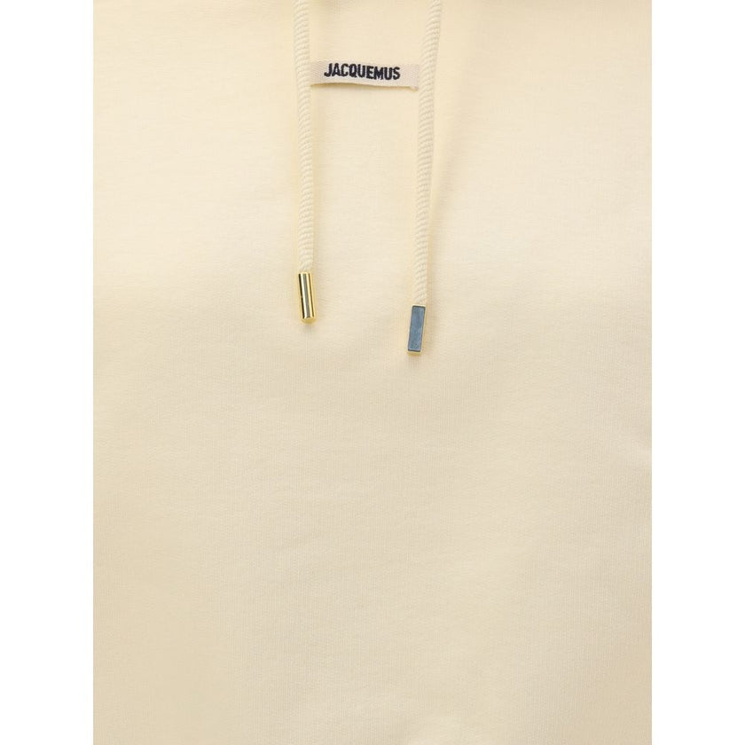 Cream Cotton SweatshirtCotton Hoodie by Jacquemus, featuring an adjustable drawstring hood for a custom fit. Featuring a logo patch on the front, ribbed cuffs and hem for a finishing touch. The slim fit flatters the silhouette, combining comfort and conte