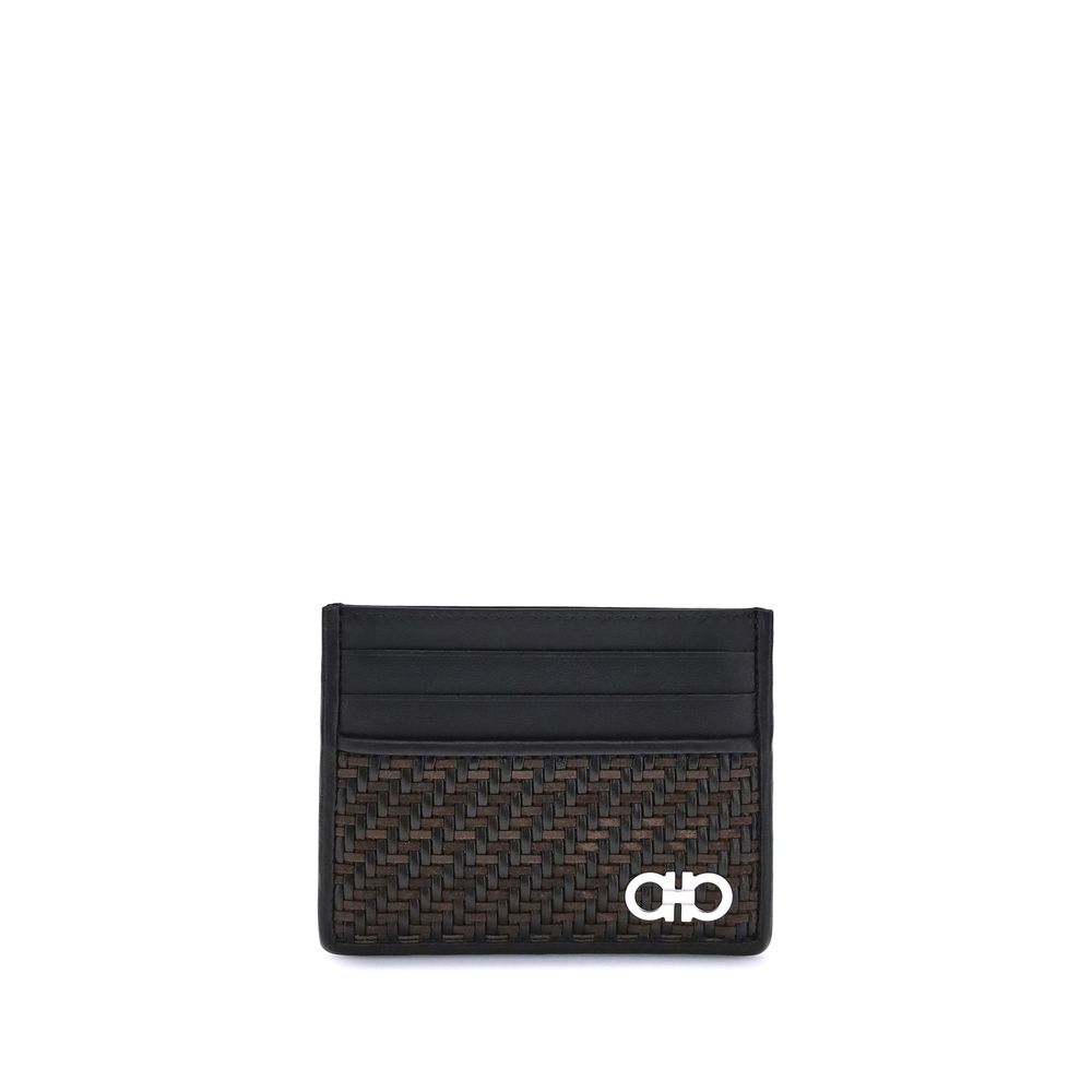 Black Calf Leather Bos Taurus WalletThe Ferragamo Gancini Card Holder combines elegance and craftsmanship in a compact and refined format. Featuring slots on both sides for practical organization, it is embellished with a palladium-finish Gancini ornament