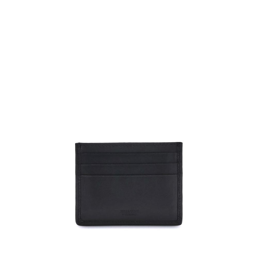 Black Calf Leather Bos Taurus WalletThe Ferragamo Gancini Card Holder combines elegance and craftsmanship in a compact and refined format. Featuring slots on both sides for practical organization, it is embellished with a palladium-finish Gancini ornament