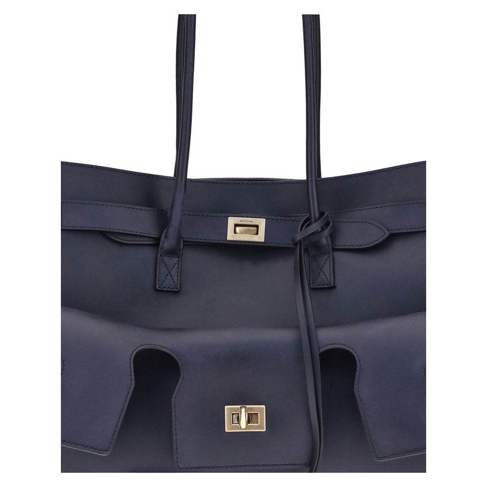 Blue Calf Leather Bos Taurus Shoulder BagThe medium Bel Air Shoulder Bag by Balenciaga combines elegance and functionality in a modern design. Carried by hand or on the shoulder thanks to the two handles, it is embellished with the Balenciaga Paris logo e
