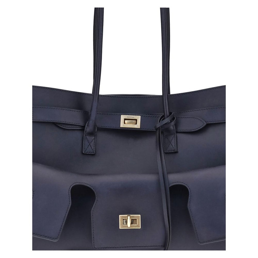Blue Calf Leather Bos Taurus Shoulder BagThe medium Bel Air Shoulder Bag by Balenciaga combines elegance and functionality in a modern design. Carried by hand or on the shoulder thanks to the two handles, it is embellished with the Balenciaga Paris logo e