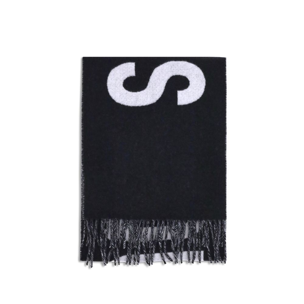 Fringes wool ScarfThe Jacquemus Wool Scarf is an essential accessory with a modern and minimal style. Made of solid-colored yarn, it is embellished with a contrasting jacquard logo, which gives character without sacrificing sobriety. The design is complet