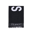 Fringes wool ScarfThe Jacquemus Wool Scarf is an essential accessory with a modern and minimal style. Made of solid-colored yarn, it is embellished with a contrasting jacquard logo, which gives character without sacrificing sobriety. The design is complet