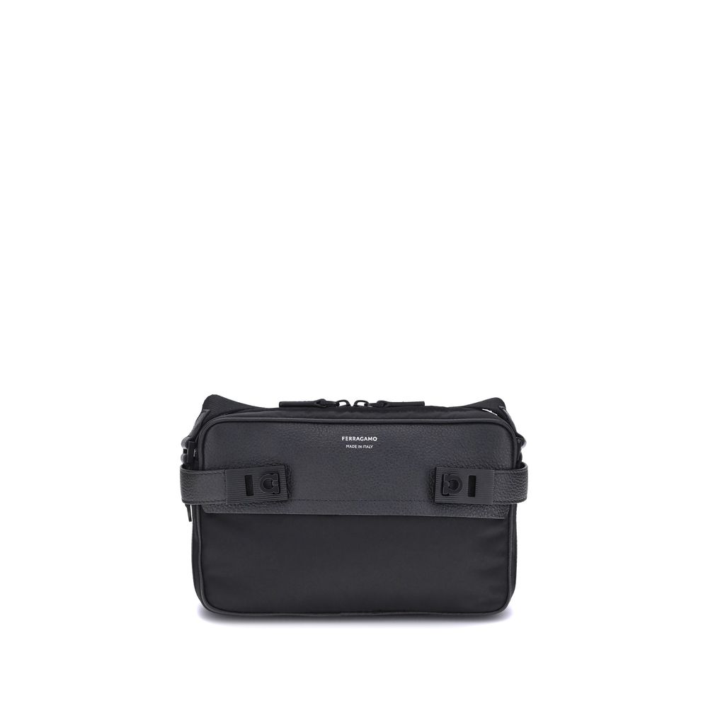 Black Calf Leather Bos Taurus Shoulder BagThe Ferragamo Gancini buckle Shoulder Bag combines style and functionality with a mix of technical fabric and hammered leather. The roomy interior with zip and a back pocket make it practical, while the patent-fin
