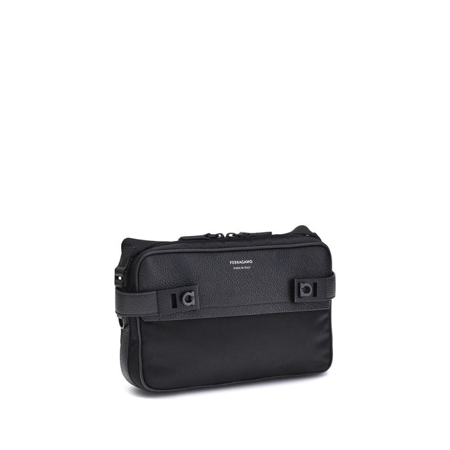 Black Calf Leather Bos Taurus Shoulder BagThe Ferragamo Gancini buckle Shoulder Bag combines style and functionality with a mix of technical fabric and hammered leather. The roomy interior with zip and a back pocket make it practical, while the patent-fin