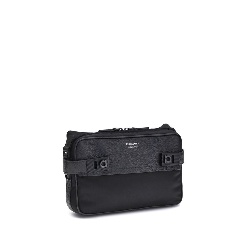 Black Calf Leather Bos Taurus Shoulder BagThe Ferragamo Gancini buckle Shoulder Bag combines style and functionality with a mix of technical fabric and hammered leather. The roomy interior with zip and a back pocket make it practical, while the patent-fin