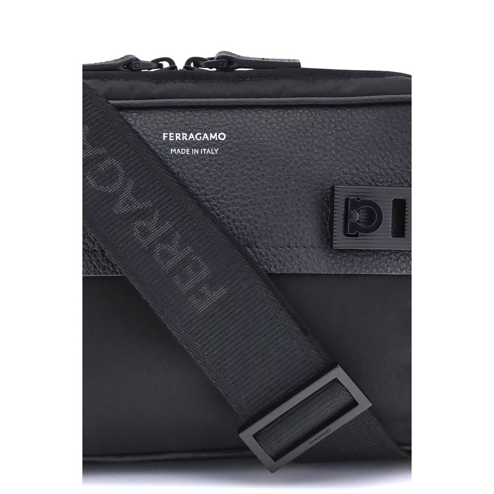 Black Calf Leather Bos Taurus Shoulder BagThe Ferragamo Gancini buckle Shoulder Bag combines style and functionality with a mix of technical fabric and hammered leather. The roomy interior with zip and a back pocket make it practical, while the patent-fin