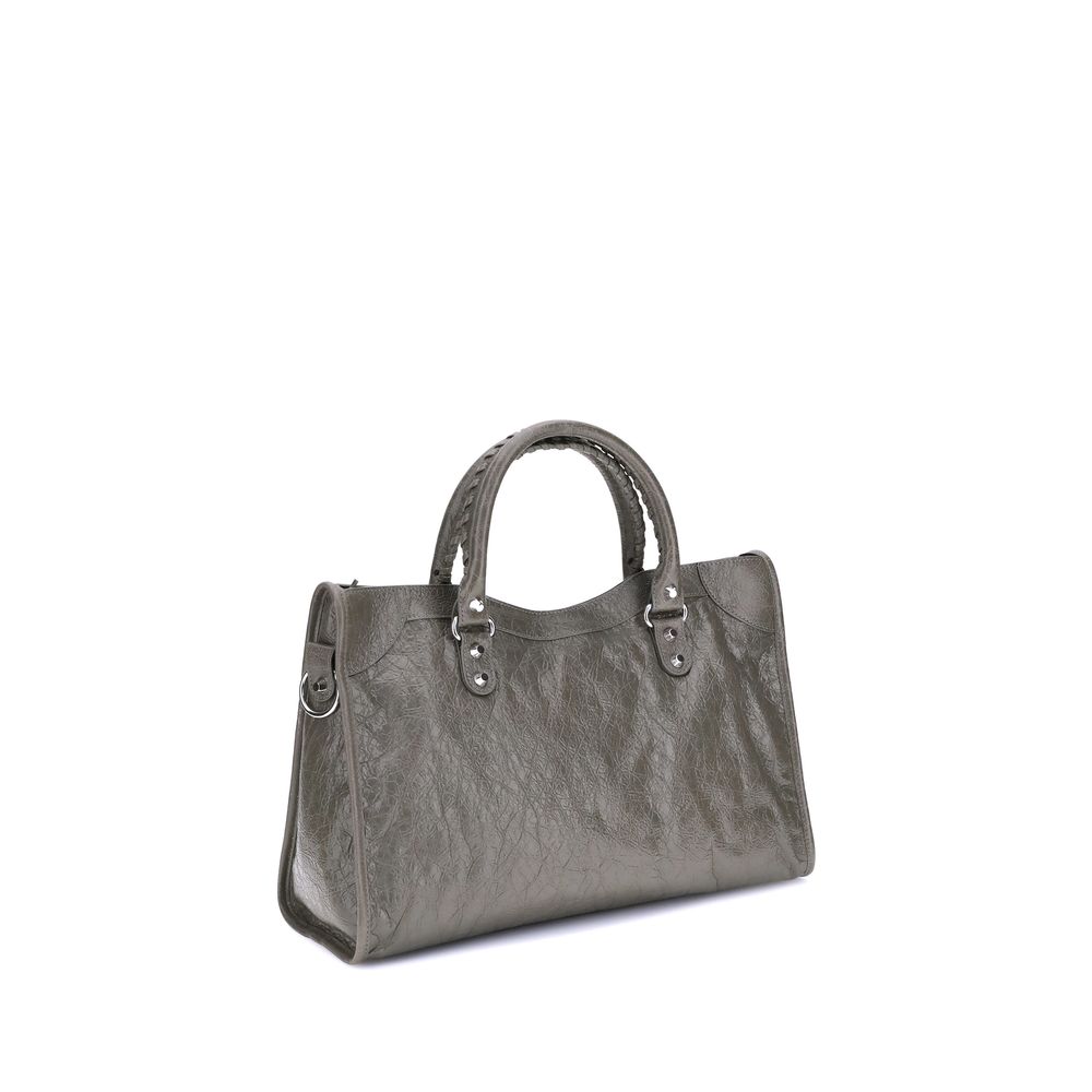 Green Calf Leather Bos Taurus Shoulder BagThe Balenciaga Le City medium Shoulder Bag is a premium piece crafted from premium lambskin that combines elegance and functionality. Two hand-woven leather handles add a refined, artisanal touch, while the adjust