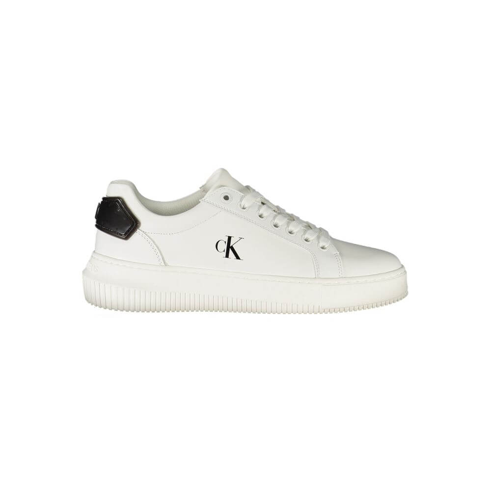 White Leather Women SneakerStep into the realm of sleek sophistication with Calvin Klein’s latest rendition of urban elegance. These sports shoes, with their crisp white demeanor accented by bold black contrasts, are more than just footwear; they’re a sta
