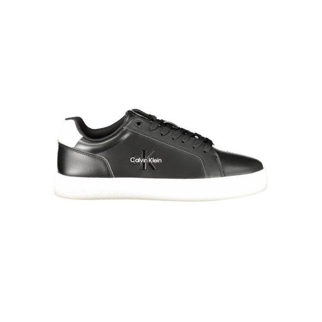 Black Leather Men SneakerStep up your game with the Calvin Klein sports shoe, where function meets fashion in a dynamic fusion. Featuring a sleek black design punctuated by bold, contrasting white details, these sneakers boast both style and substance. Th