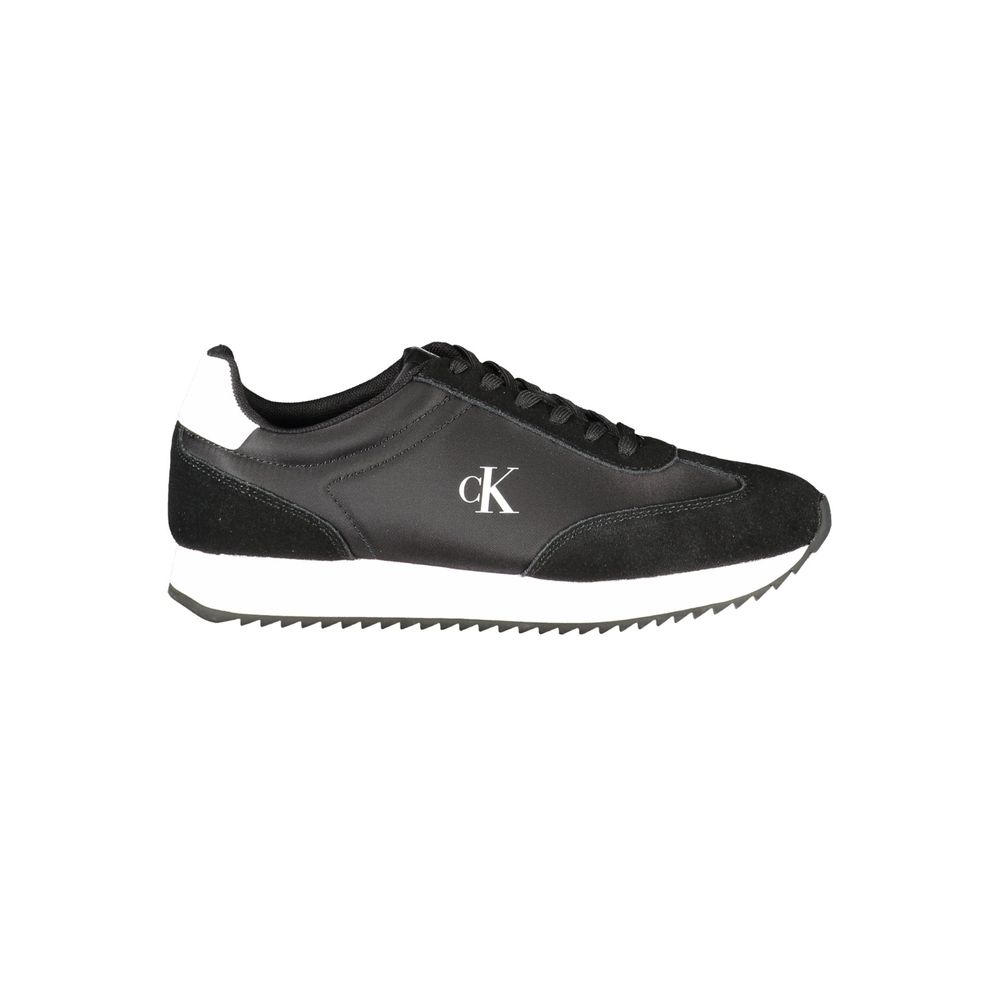 Black Leather Women SneakerDare to make a statement with these Calvin Klein sneakers, a perfect fusion of sporty elegance and modern flair. These kicks are designed to elevate your game – on and off the court – featuring striking contrasting details and t