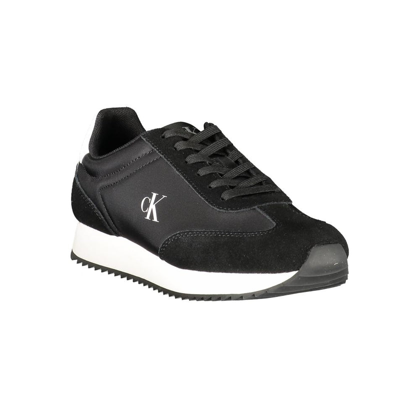 Black Leather Women SneakerDare to make a statement with these Calvin Klein sneakers, a perfect fusion of sporty elegance and modern flair. These kicks are designed to elevate your game – on and off the court – featuring striking contrasting details and t