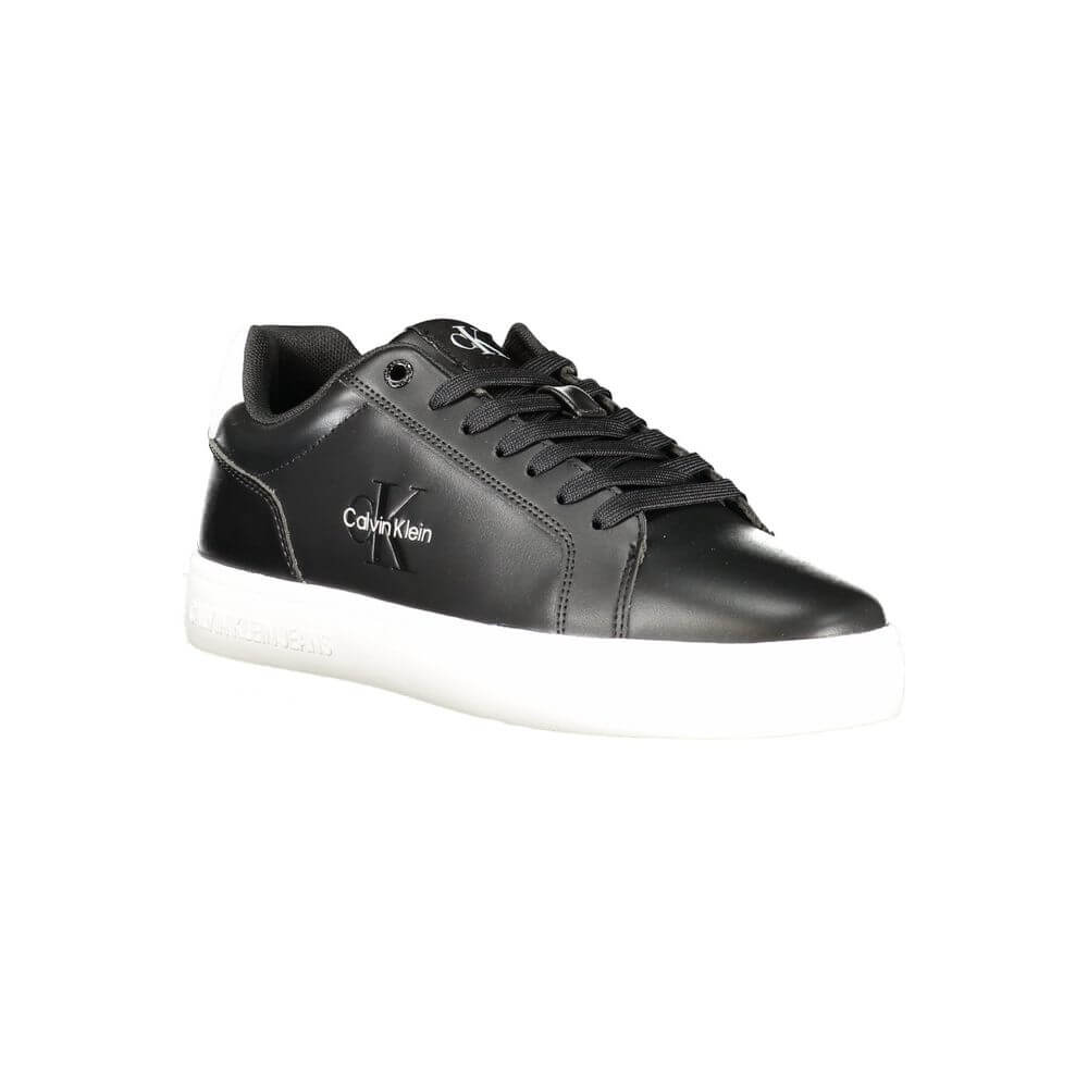 Black Leather Men SneakerStep up your game with the Calvin Klein sports shoe, where function meets fashion in a dynamic fusion. Featuring a sleek black design punctuated by bold, contrasting white details, these sneakers boast both style and substance. Th