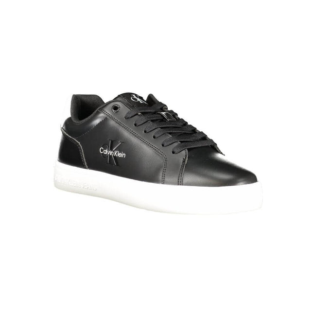 Black Leather Men SneakerStep up your game with the Calvin Klein sports shoe, where function meets fashion in a dynamic fusion. Featuring a sleek black design punctuated by bold, contrasting white details, these sneakers boast both style and substance. Th