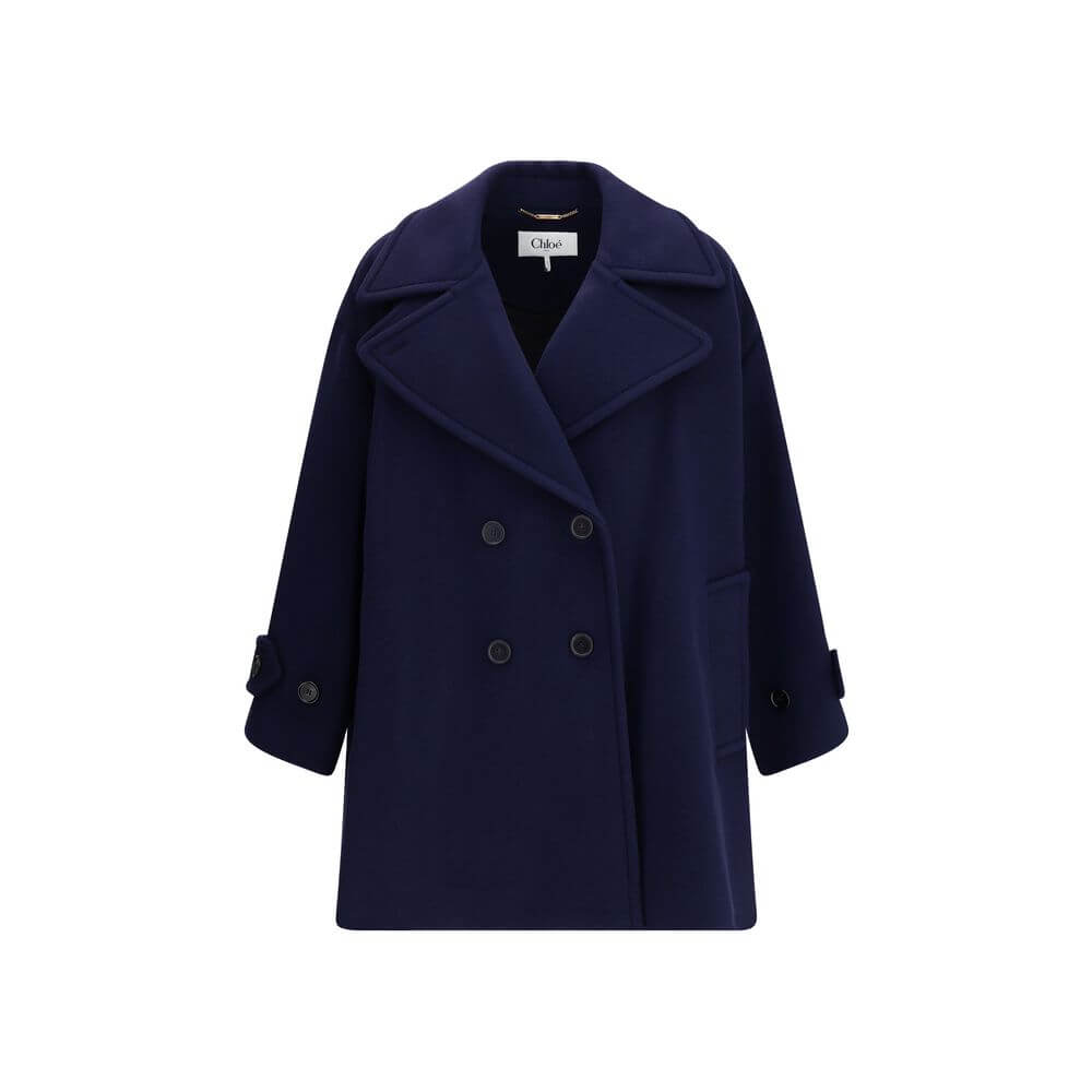 Blue Wool CoatThe Chloé oversized double breasted Wool Coat is a sleek, structured piece for the cold season. Featuring wide lapels and a collar strap, it is finished with engraved horn buttons at the collar, front and cuffs. Side pockets and a knee-lengt