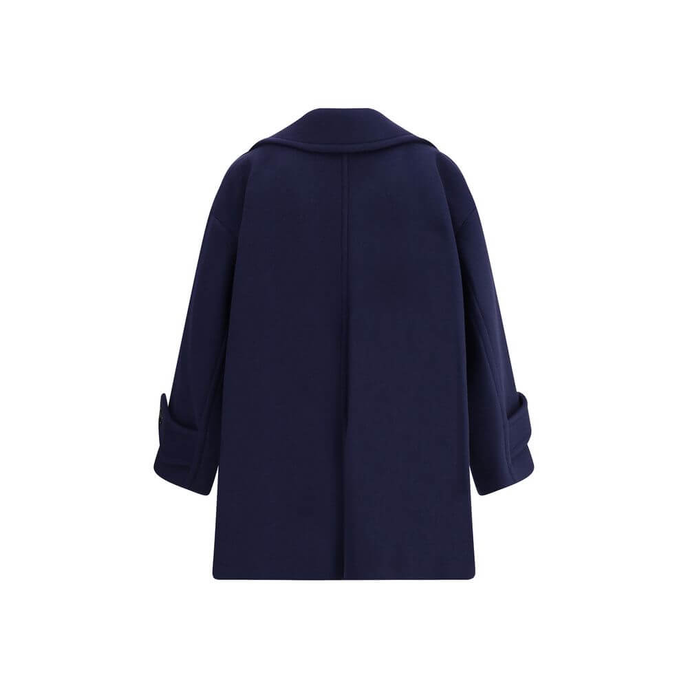 Blue Wool CoatThe Chloé oversized double breasted Wool Coat is a sleek, structured piece for the cold season. Featuring wide lapels and a collar strap, it is finished with engraved horn buttons at the collar, front and cuffs. Side pockets and a knee-lengt