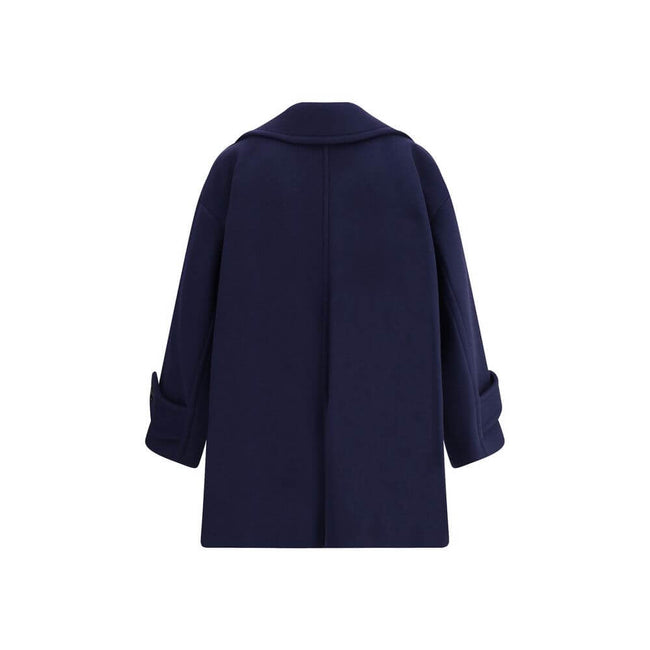Blue Wool CoatThe Chloé oversized double breasted Wool Coat is a sleek, structured piece for the cold season. Featuring wide lapels and a collar strap, it is finished with engraved horn buttons at the collar, front and cuffs. Side pockets and a knee-lengt