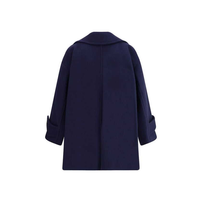 Blue Wool CoatThe Chloé oversized double breasted Wool Coat is a sleek, structured piece for the cold season. Featuring wide lapels and a collar strap, it is finished with engraved horn buttons at the collar, front and cuffs. Side pockets and a knee-lengt